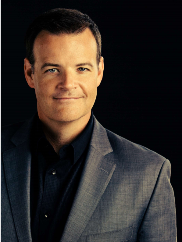 Portrait of Matt Kennedy in a gray suit