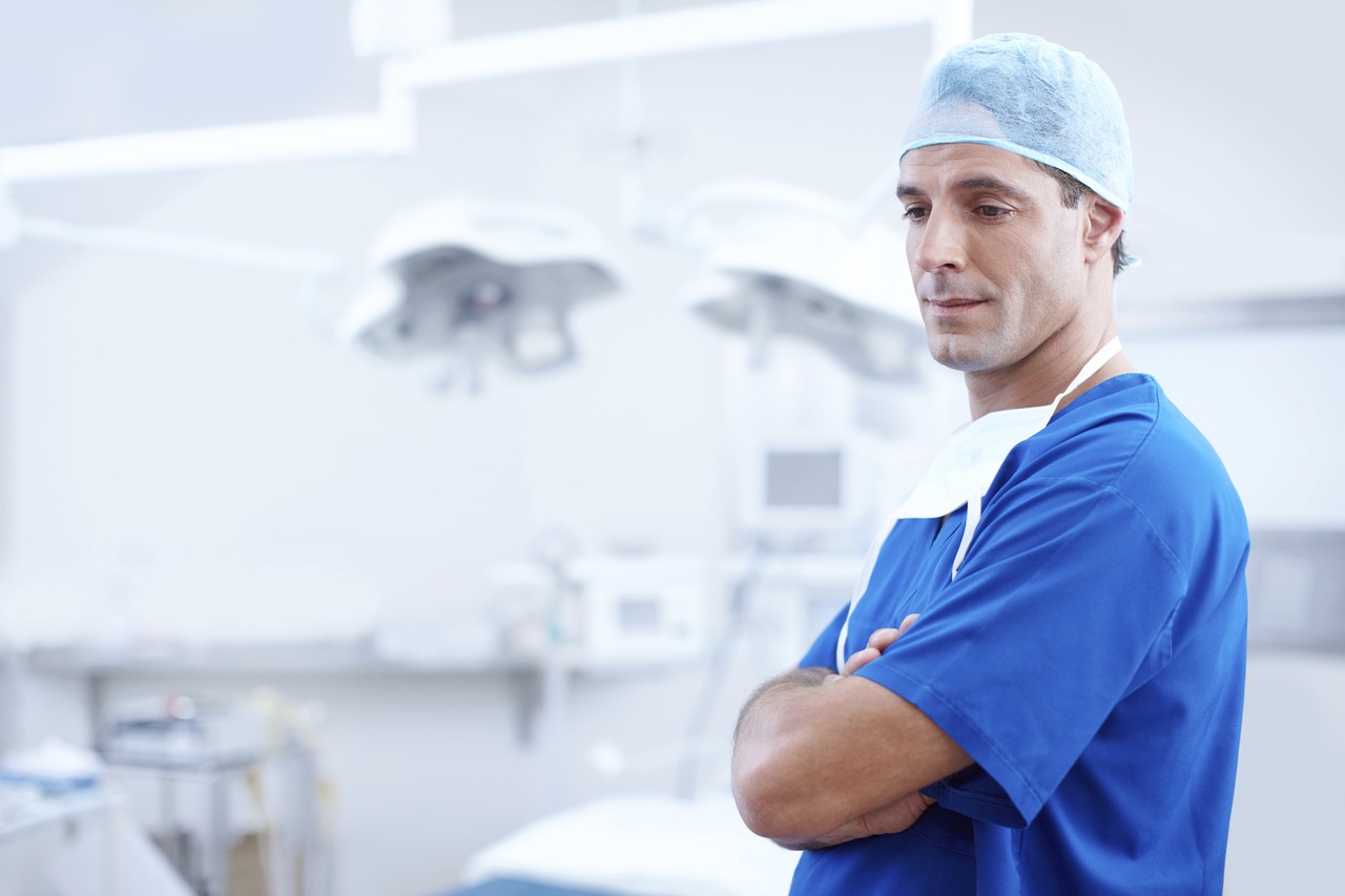 Dentist in scrubs standing in clinic